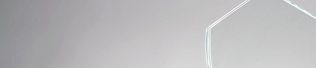 Crystal Award in front of a grey background