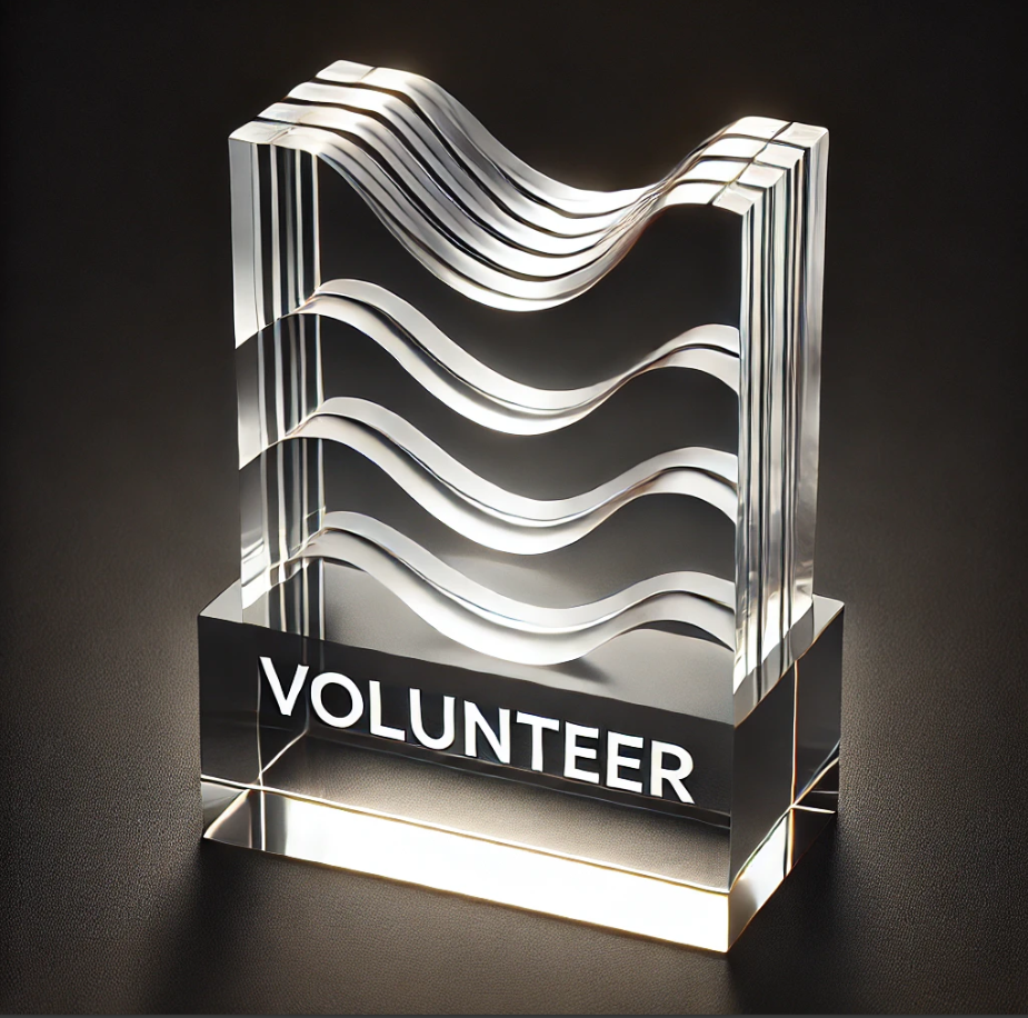 Acrylic award with wavy design engraved 'Volunteer,' ideal for community awards in Toronto and recognizing volunteer achievements.